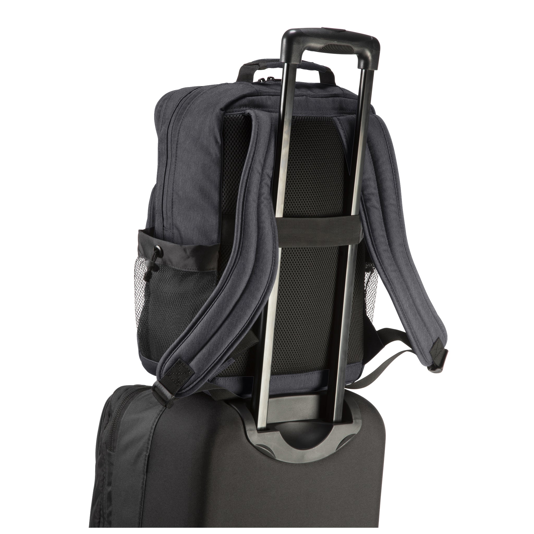 heather gray oslo backpack on a suitcase